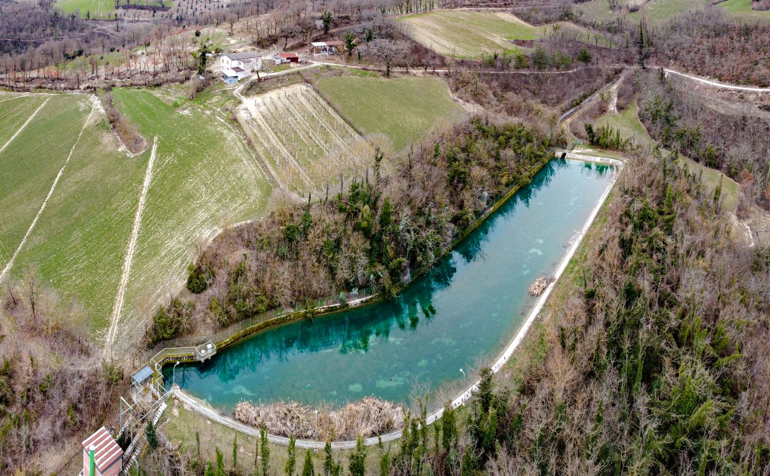 Aerial view of a rural lake and fields